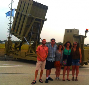 Me with my fellow Masa participants at Tel Nof Air Force Base, Iron Dome behind us